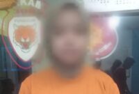Tersangka SCI saat diamankan di Polsek Punggur, Senin 15 Juli 2024. Foto : Polres Lampung Tengah.