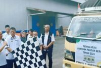 Pj Bupati Tanggamus saat melepas bantuan pangan beras tahap III di gudang bulok, pugung, Kamis 15 Agustus 2024.