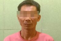 Tersangka RAD saat diamankan di Polsek Mataram Lampung Tengah.