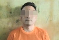 Tersangka FRE saat diamankan Polsek Kalirejo Lampung Tengah.