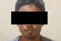 Tersangka DRA saat diamankan di Polsek Terbanggi Besar, Lampung Tengah.