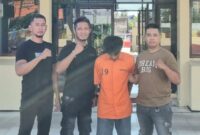 Tersangka Bejo saat diamankan di Polsek Pringsewu Kota.