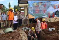Peletakan batu pertama pembangunan gedung SPKT Polres Tanggamus, Selasa 5 Nopember 2024.