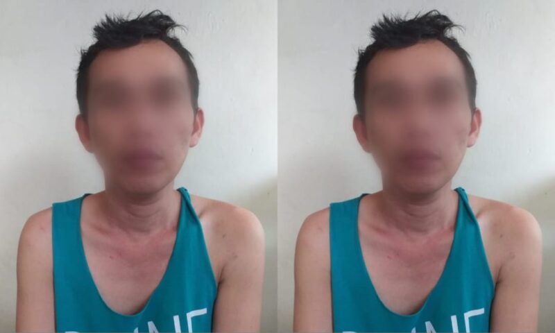 Tersangka yang mengaku bernama Peri alias Kirut setelah ditangkap Polisi.