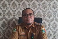 Plt. KUPT Puskesmas Air Naningan, Tanggamus saat memberikan keterangan di ruang kerjanya, Senin 9 Desember 2024 | Asrul Ariski)