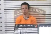 Pelaku Rudi Sihombing setelah diamankan pihak kepolisian.