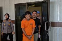 Tersangka Juriansyah saat digelandang menuju lokasi Konferensi Pers Polresta Bandar Lampung, Kamis 13 Februari 2025 | Dok. Humas Polda Lampung.