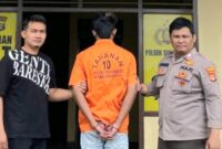 AM tersangka Mucikari di Sukoharjo Pringsewu saat akan dijebloskan ke sel tahanan, Minggu 9 Maret 2025 | Dok. Humas Polres Pringsewu.
