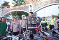 Tim gabungan saat mengamankan puluhan sepeda motor dalam balap liar di Jalur Dua Gunung Sakti, Kelurahan Menggala Selatan, Kecamatan Menggala, pada Senin (3/3/2025) sekitar pukul 05.30 WIB.