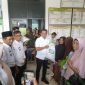 Penyaluran bantuan pangan pemerintah di Pekon Sidodadi, Pardasuka, Pringsewu, Kamis 23 Juli 2025 | Samuel/Media Prioritastv.com.