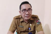 Johansyah (PPTK), Kepala Bidang Cipta Karya Dinas Perkim Lampung Utara saat memberikan keterangan di ruang kerjanya | Foto : Dok.