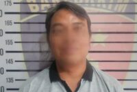 Tersangka BDH, pegawai koperasi yang menggelapan dana setoran Rp223 juta yang ditangkap polisi pada Jumat 7 November 2025 | Dok. Humas Polres Tanggamus.