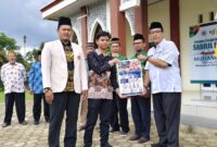 Peluncurkan PSB dan Layanan Lazismu apel peringatan Milad ke-113 Muhammadiyah di halaman Masjid Ummul Mukminin Aisyah Binti Abu Bakar RA, kompleks asrama putra Ponpes Sabilil Muttaqien, Jl. Irigasi No. Blok 1, Gisting Bawah, Kecamatan Gisting, Kabupaten Tanggamus, Selasa (18/11/2025) | Media Prioritastv.com.