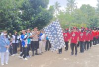 Kapolsek Pugung, Ipda Dr. Agus Tri Kurniawan, S.H., M.H., Saat Buka Kegiatan Gerak Jalan dalam Rangka HUT PGRI ke-80. Asrul Ariski/Media Prioritastv.com