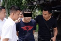 Tersangka saat digiring Polres Lampung tengah menuju tahanan usai ditangkap pada Selasa 20 Januari 2026 | Dok. Humas Polres Lampung Tengah.