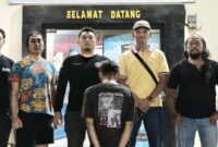 Tersangka IM saat berada di Polsek Pulau Panggung setelah diamankan tim gabungan pada Minggu 25 Januari 2026 | Dok. Humas Polres Tanggamus.