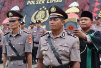 Kapolsek Pulau Panggung Iptu Suamin saat diambil sumpah jabatan didampingi rohaniawan Polres Tanggamus, Kamis 5 Maret 2026 | Dok. Humas Polres Tanggamus.