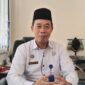 Kepala Subbag Tata Usaha (Kasubbag TU) Kementerian Haji dan Umrah Kabupaten Tanggamus, Sahari AZ saat memberikan keterangan pers kepada Media Prioritastv.com, Kamis 18 Juni 2026 | Herdi/Media Prioritastv.com.