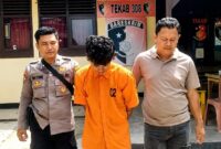 Tersangka Nanda Diwangga saat digiring polisi ke sel tahanan, Senin 10 Agustus 2026 | Dok. Humas Polres Pringsewu.